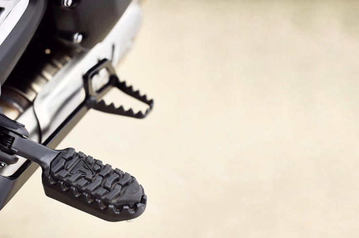 The Scrambler 400 X gets more off-road-friendly footpegs and brake lever. The Scrambler 400 X gets more off-road-friendly footpegs and brake lever.